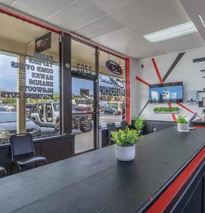 Front window and counter at The Official Barbershop on Gulf to Bay Blvd